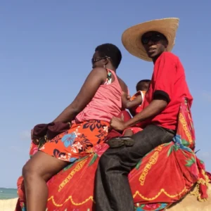 Beverley and Emmanuel on a camel.