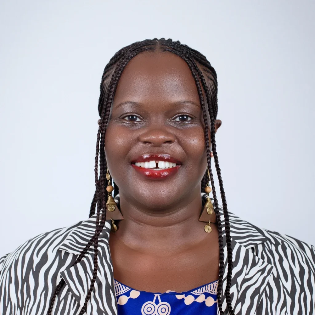 Beverley in a zebra print blazer with braided hair.